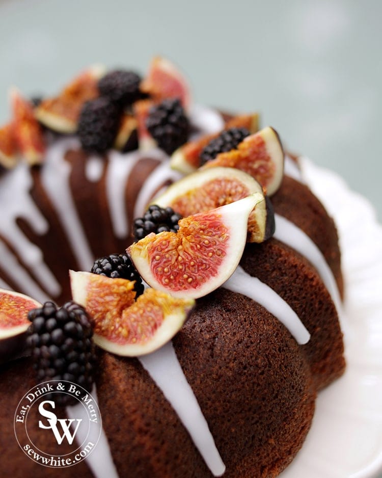 Close up of the Autumn bundt Cake. Red figs and blackberries in the autumn light.