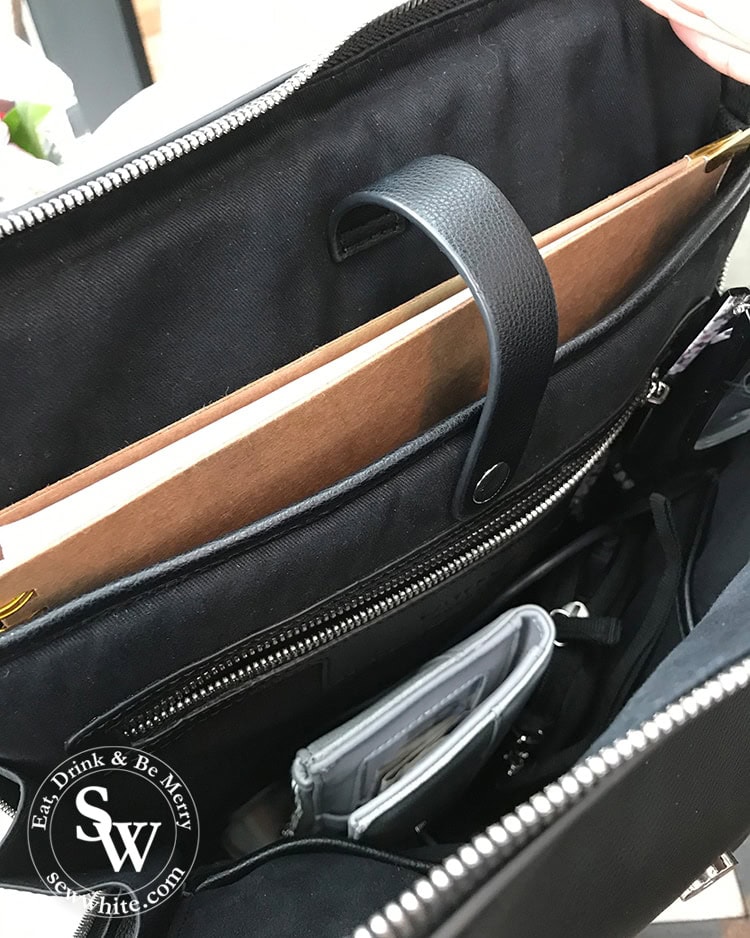 Inside the black leather bag with space for laptop and notes. Bag from lawful London