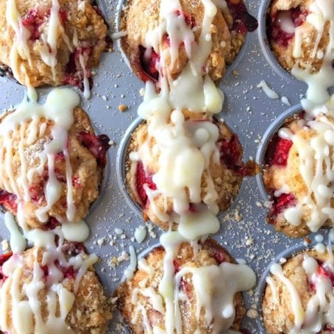 Miniature strawberry coffee cake muffins are not only topped with fresh strawberries, but have them mixed into the batter and are sprinkled with a divine sugar streusel. Welcome Spring!