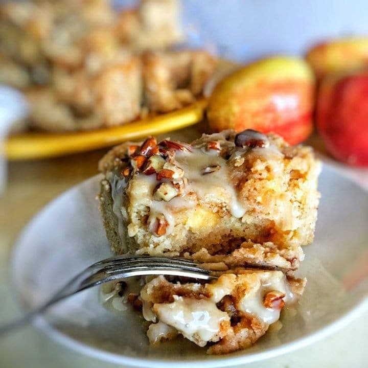 Apple coffee cake is the ultimate fall dessert! Tender and moist, with a brown sugar-pecan swirl throughout, and cinnamon-sugar streusel on top. Don't forget that maple-vanilla glaze!