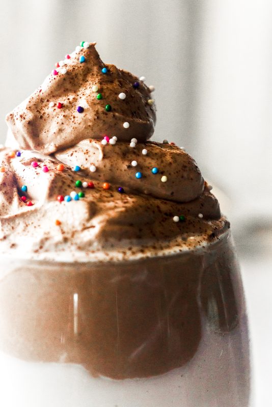 close up of whipped chocolate and sprinkles
