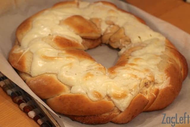 a king cake with cream cheese filling just out of the oven