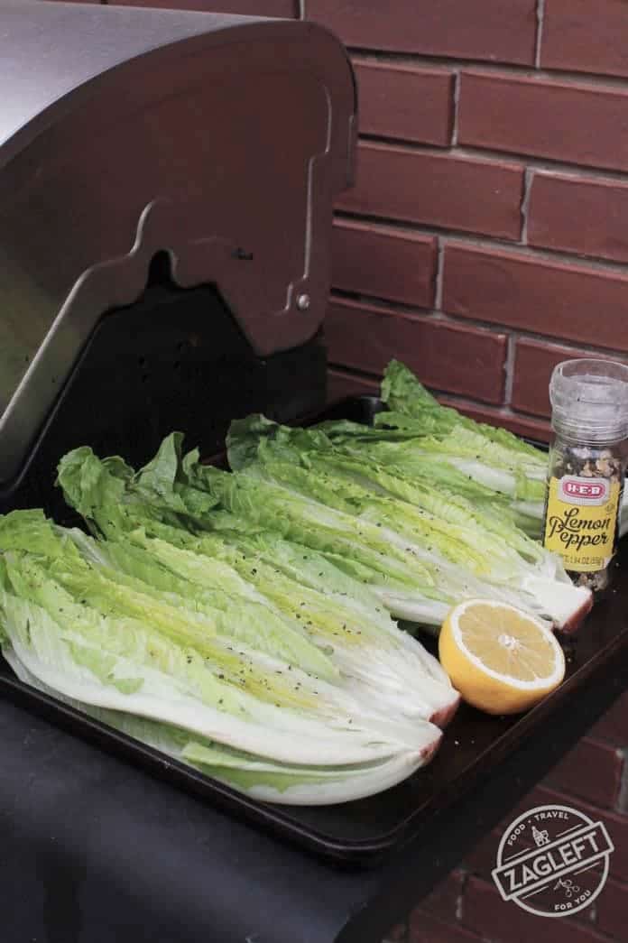 Romaine lettuce covered with olive oil, salt and pepper ready to go on the grill - zagleft