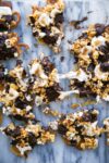 This loaded bark is made with graham crackers, pretzels, peanuts, toffee, popcorn, chocolate, and toasted marshmallows. Betcha can't eat just one!