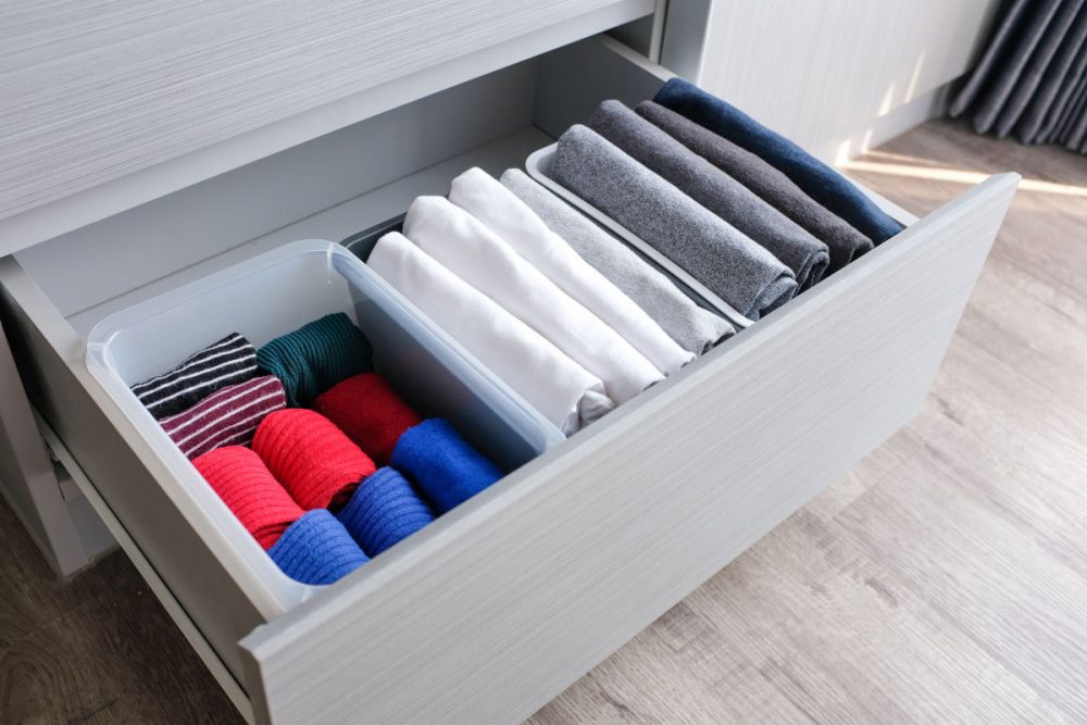 clothes neatly folded and stored in a drawer