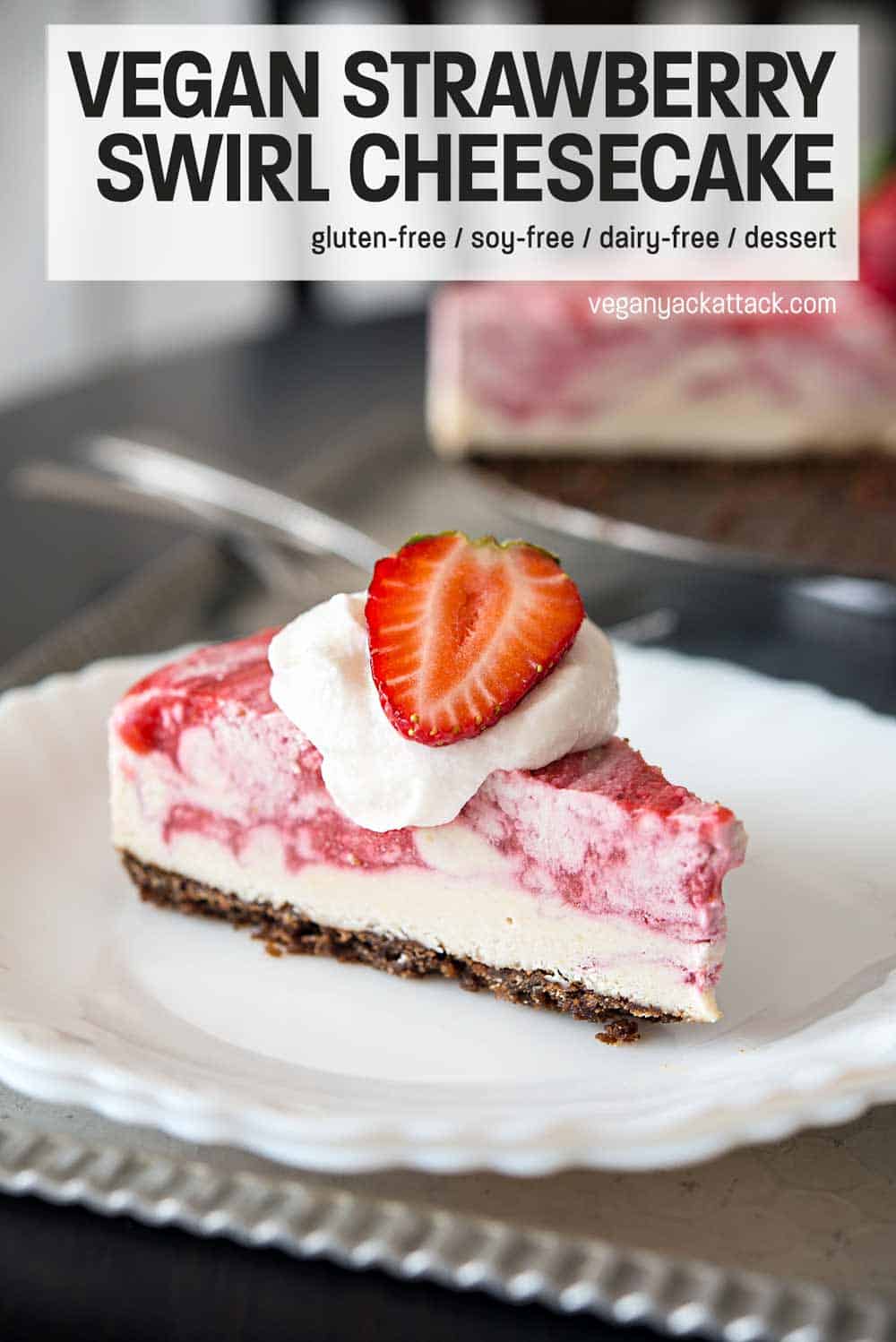Slice of strawberry swirl cheesecake on a white plate