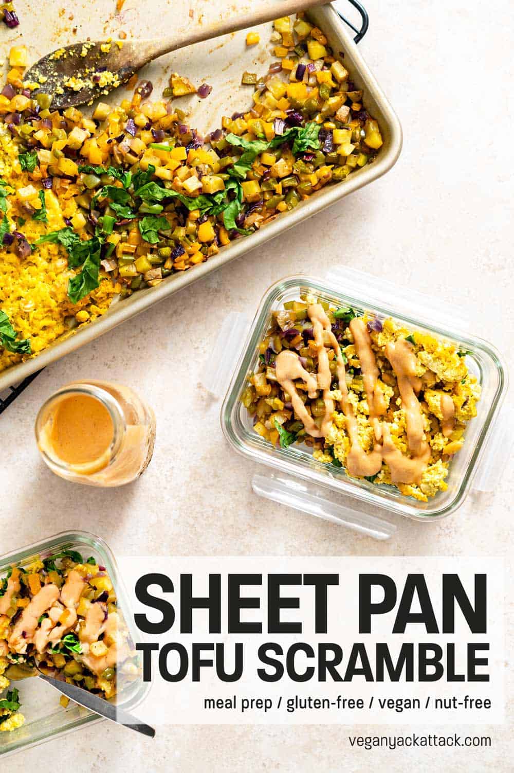 Two meal prep containers filled with Sheet Pan Tofu Scramble and hash, drizzled with sauce, next to a sheet pan
