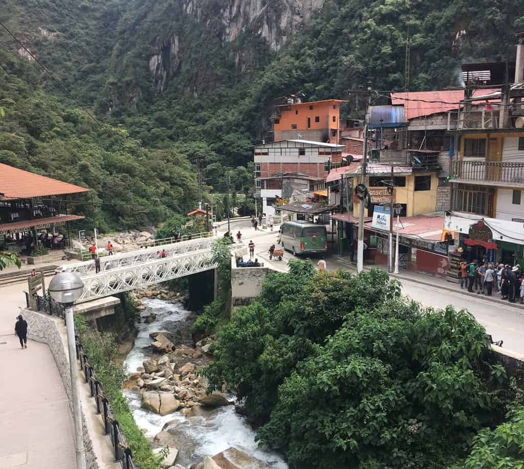 Aguas Calientes: the green bus you seen on the other side of the bridge is the bus you need to take to Machu Picchu