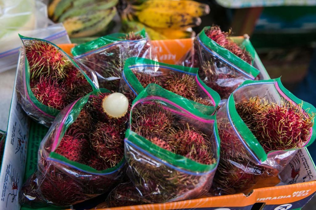 Rambutans for sale at the Wat Mongkolratanaram, photographed by NYC photojournalist, Kelly Williams