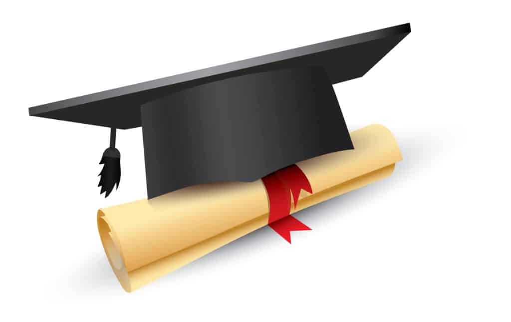 Graduation cap sitting on top of a diploma.