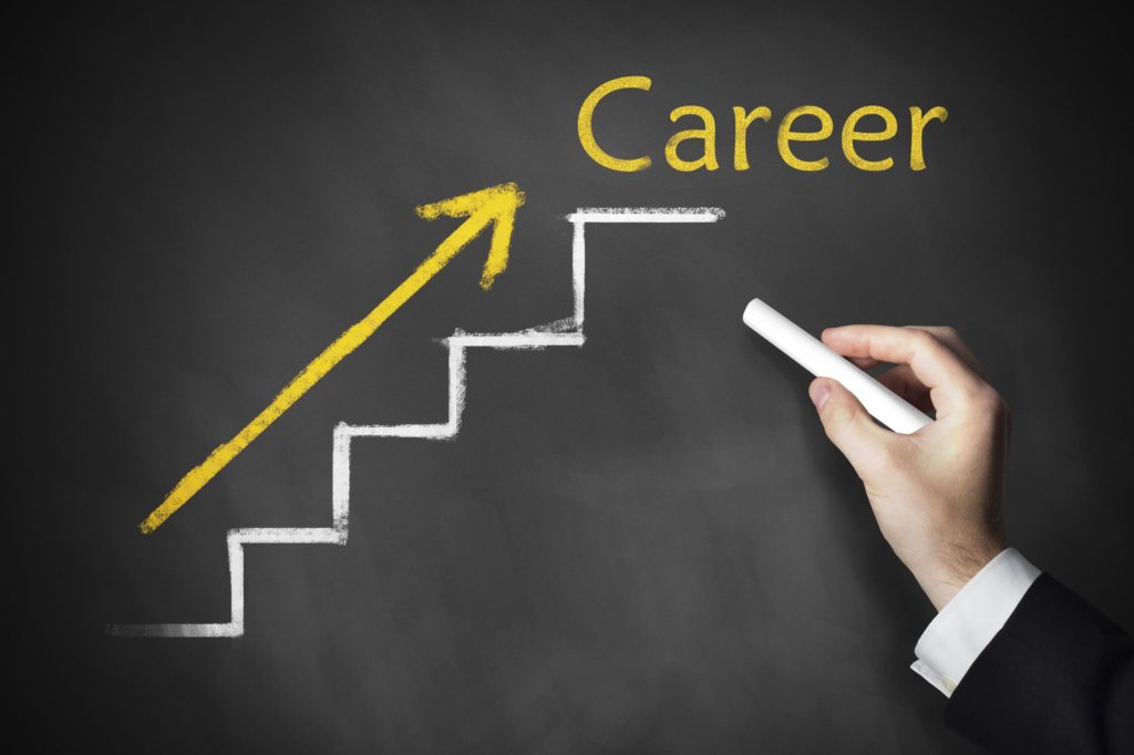 Word career written on a chalkboard with an upward pointing arrow.