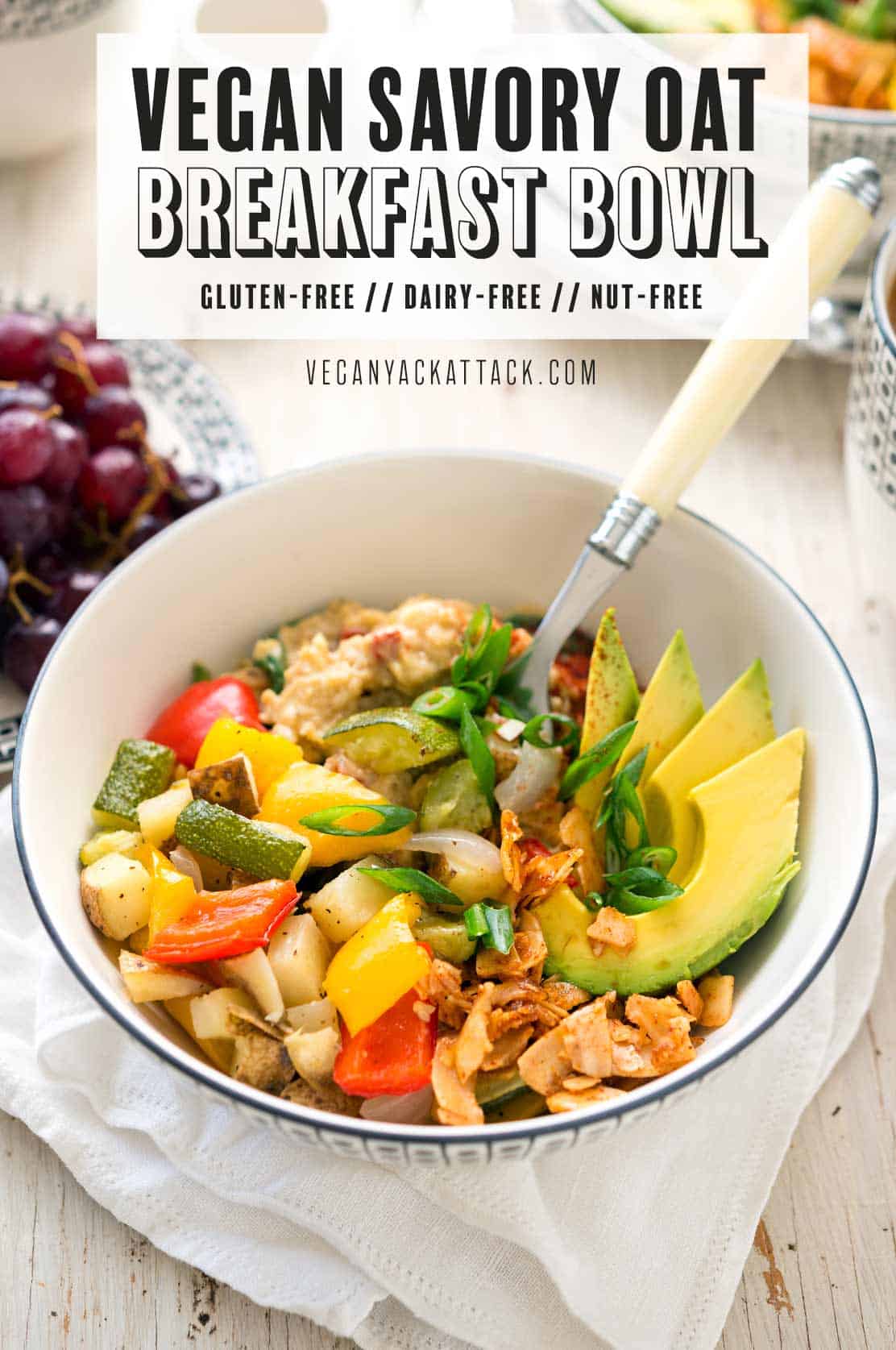 Image of food in bowl on a white table top with white linen, and text reading "vegan savory oat breakfast bowl"
