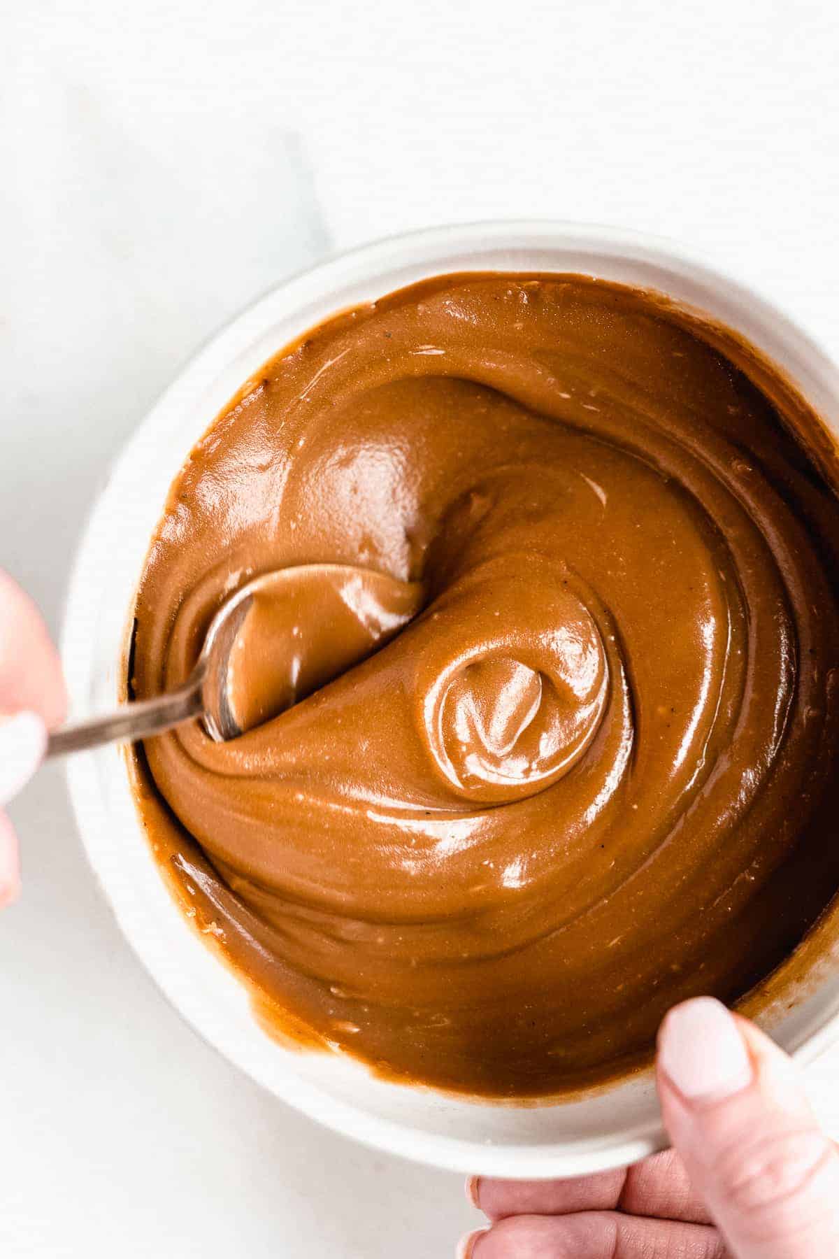 Zoomed in photo of the creamy 3-Ingredient Vegan Caramel Sauce from above.