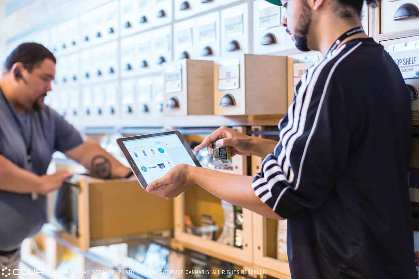 Budtender using iPad at dispensary