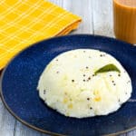 plate of upma and glass of tea
