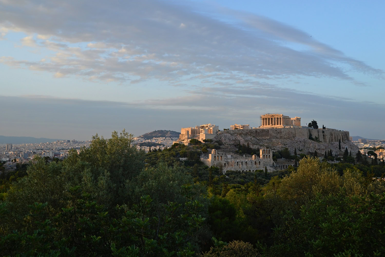View of the Acropolis of Athens at sunset from Filopappou Hill, Athens, Greece