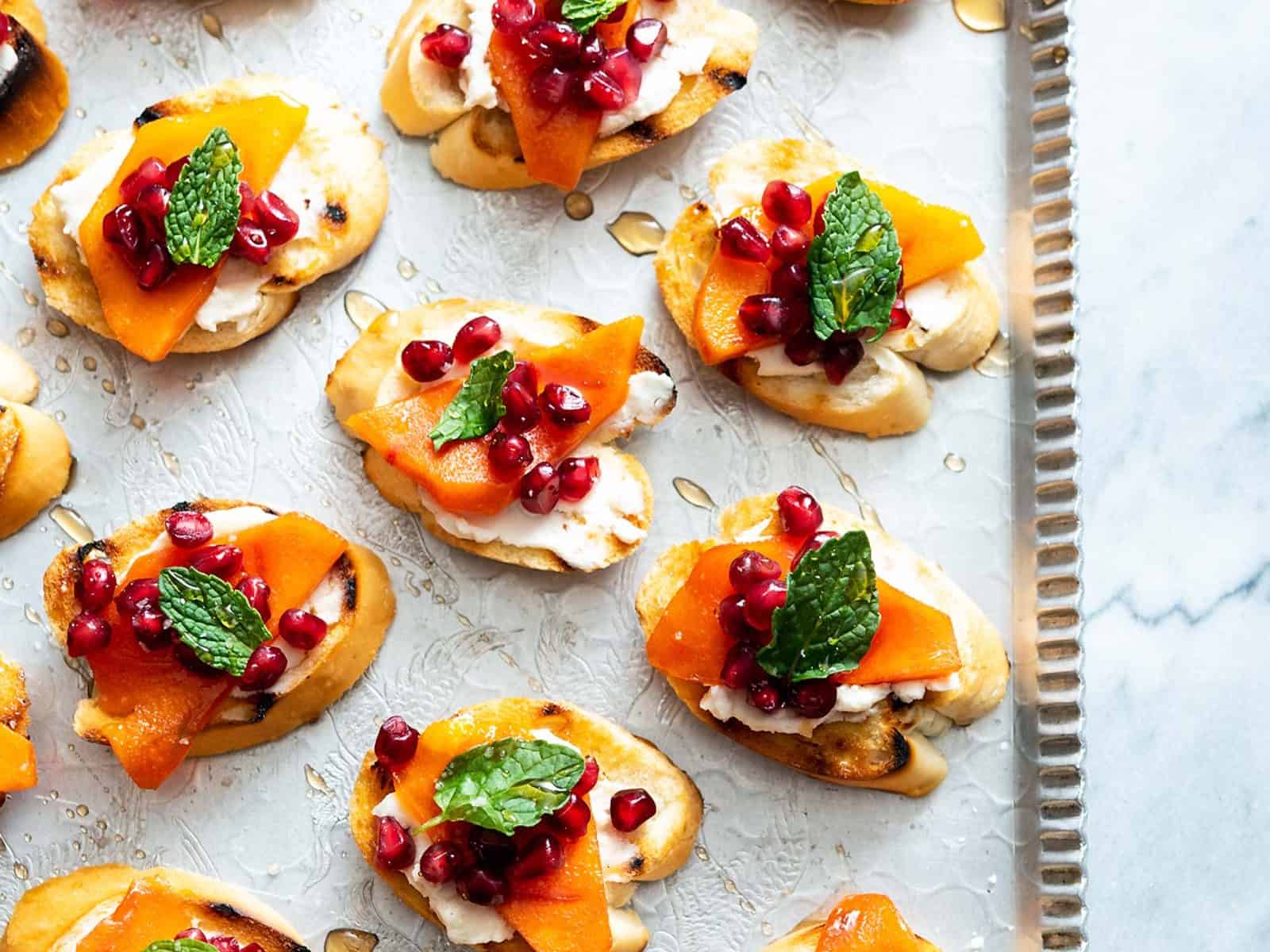 These Pomegranate Persimmon Crostini are as delicious as they are gorgeous. Plus, VERY easy-to-make! #vegan #soyfree #appetizer #veganyackattack