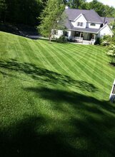 big lawn with house at the bottom