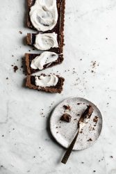 A Mocha Chocolate Tart made with a chocolate graham cracker crust, rich mocha filling, and topped with a crème fraîche whipped cream!