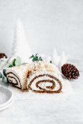 This festive White Chocolate Gingerbread Yule Log is a showstopper Christmas dessert. Made with white chocolate buttercream "bark" for that rustic look!