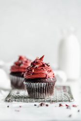 chocolate cupcakes for two topped with pink raspberry frosting