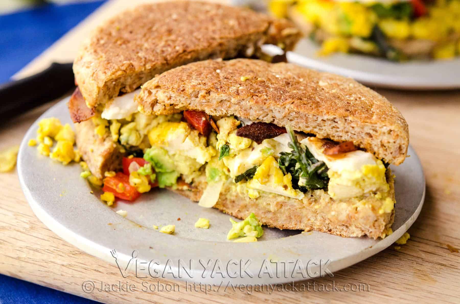 Delicious and filling Tofu Scramble Breakfast Sandwiches made up of a savory tofu scramble, vegan mozzarella and coconut bacon!