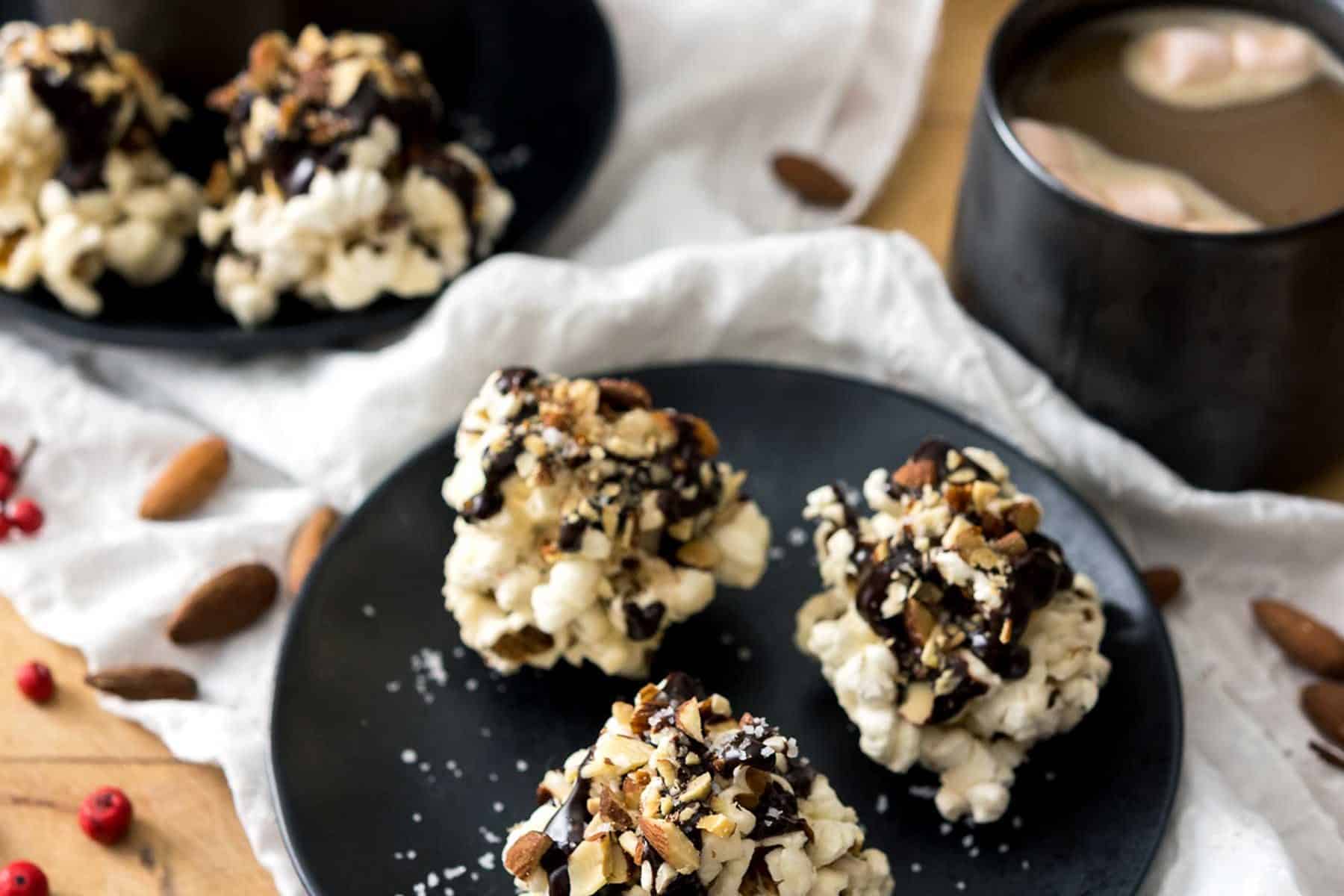 Rocky Road Popcorn Clusters are a wonderfully easy treat to make for holiday festivities, or as gifts for the sweet lovers in your life! Chewy, chocolate-covered, with toasted almonds and salt, what’s not to love? #vegan #glutenfree