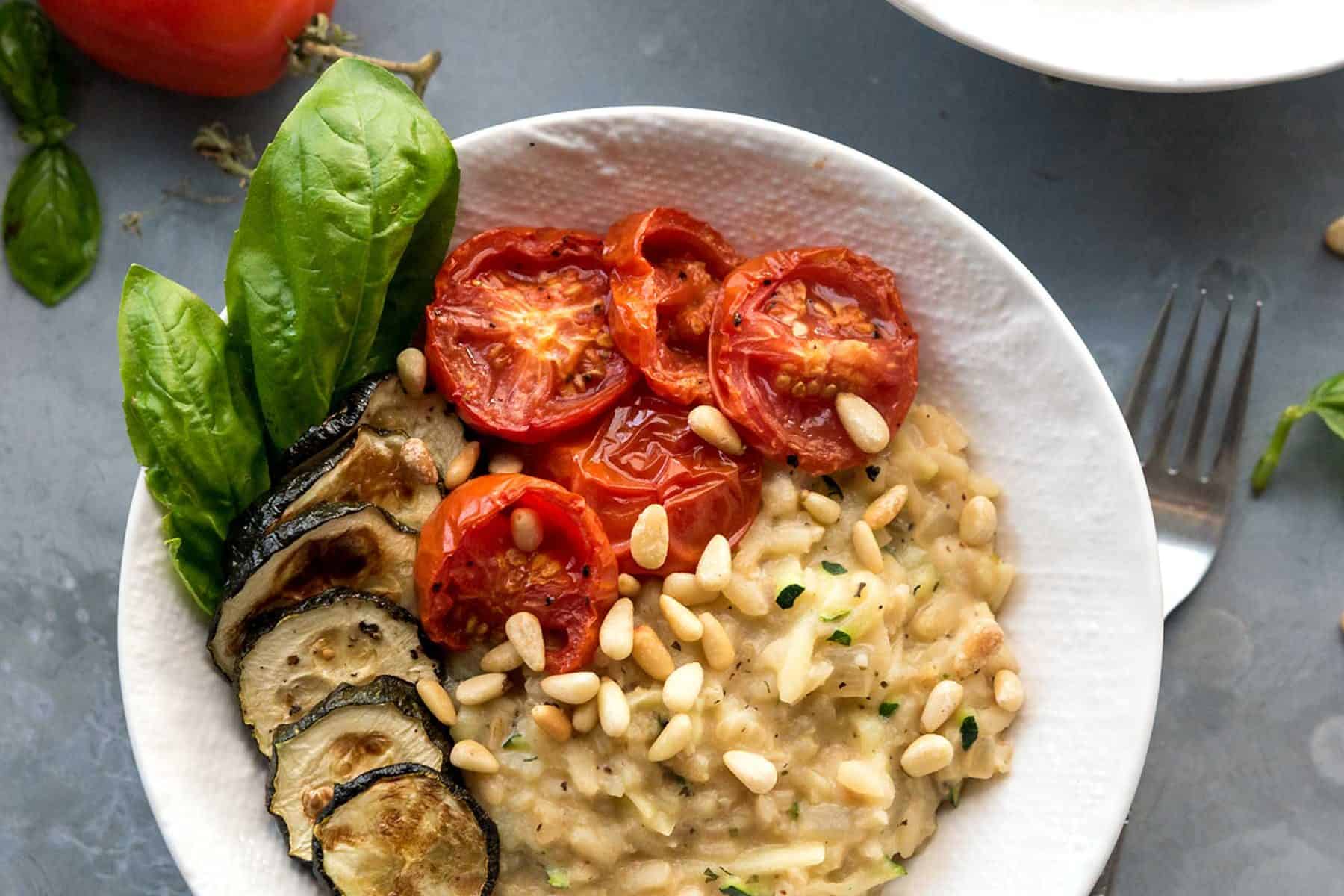 This Zucchini Risotto with Roasted Tomatoes screams summer! Dairy-free, ultra-comforting and delicious. #vegan #glutenfree #soyfree #veganyackattack