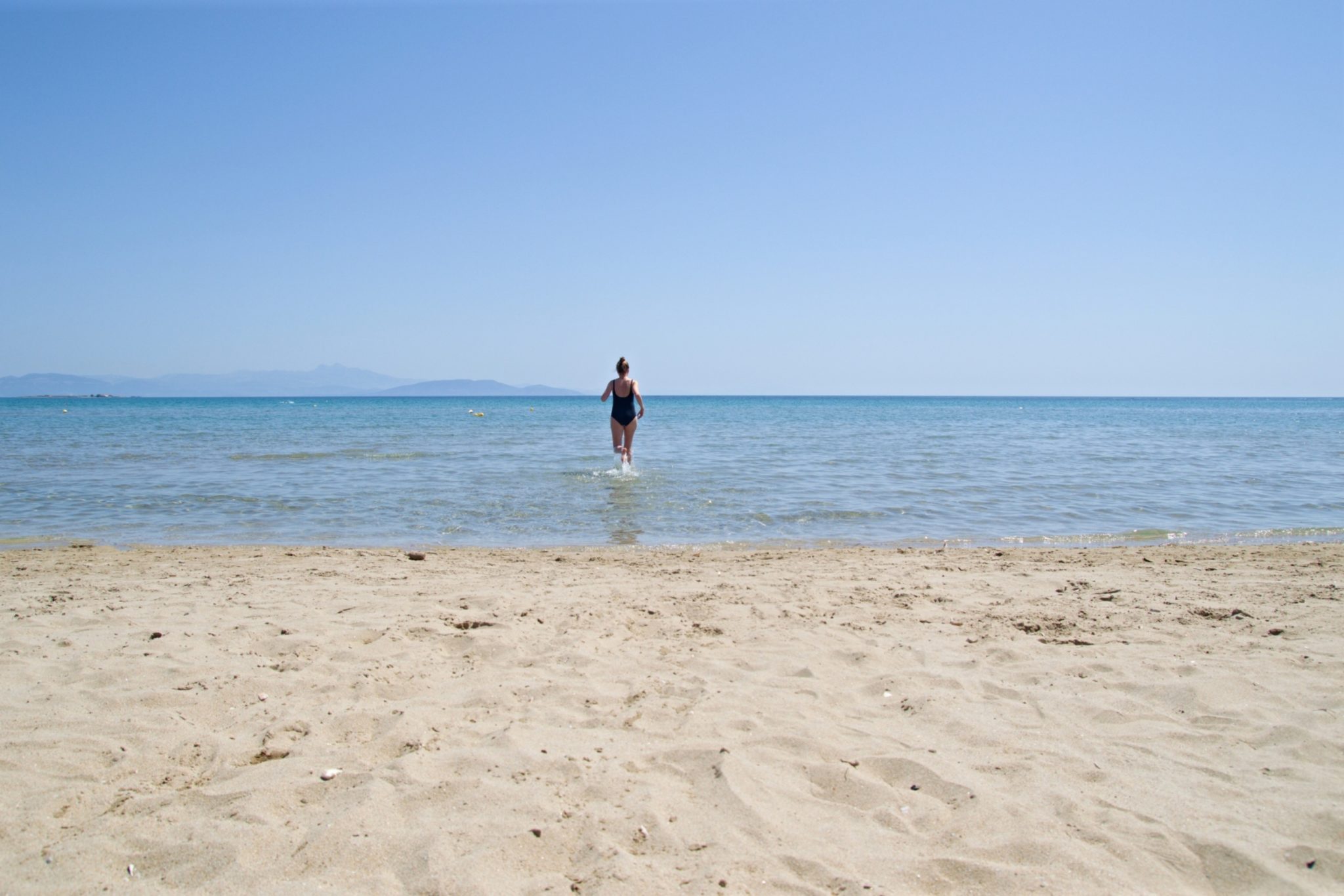 Enojoing the shallow sea at Loutsa Beach
