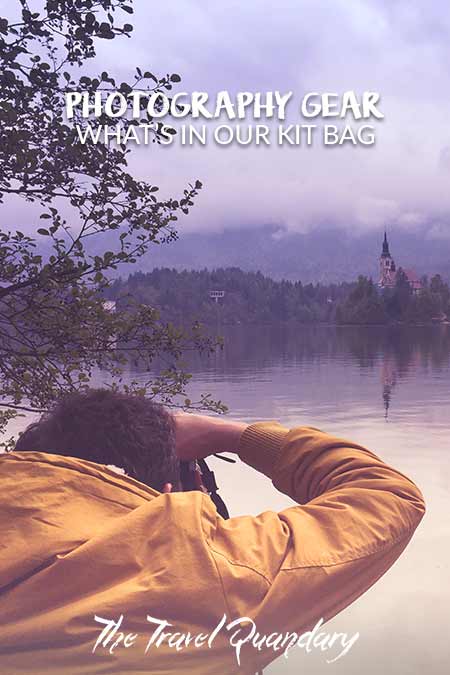 Bevan of The Travel Quandary snaps a photo of Bled Island from the banks of Lake Bled in Slovenia