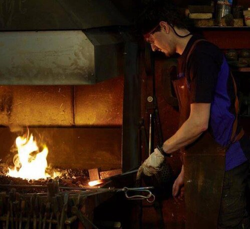 Blacksmith of company Fittkau at the fire