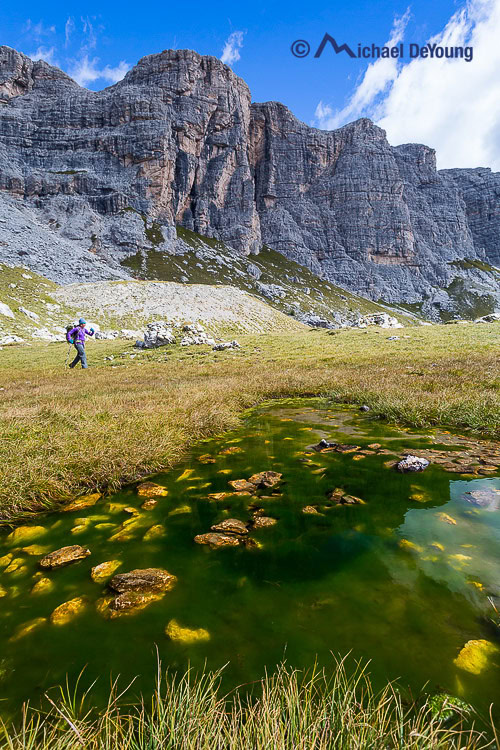 hiker along Alta Via 1, Dolomites, Italy