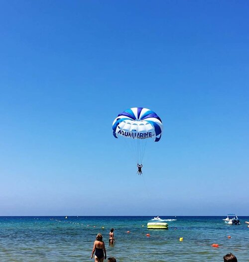 2 people doing paragliding at golden sand bay