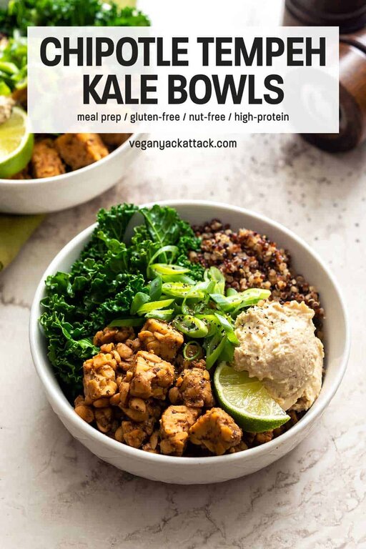 Close up shot of vegan bowl entree in a white bowl on marble with text overlay "Chipotle Tempeh Kale Bowls"
