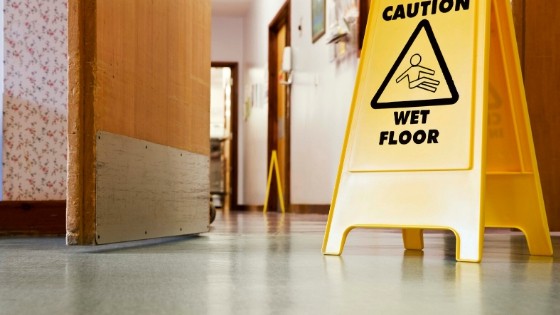 caution wet floor sign slip and fall risk
