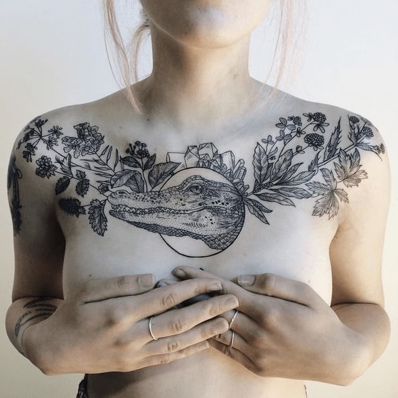 flowers leaves and frame with crocodile tattoo design on upper chest