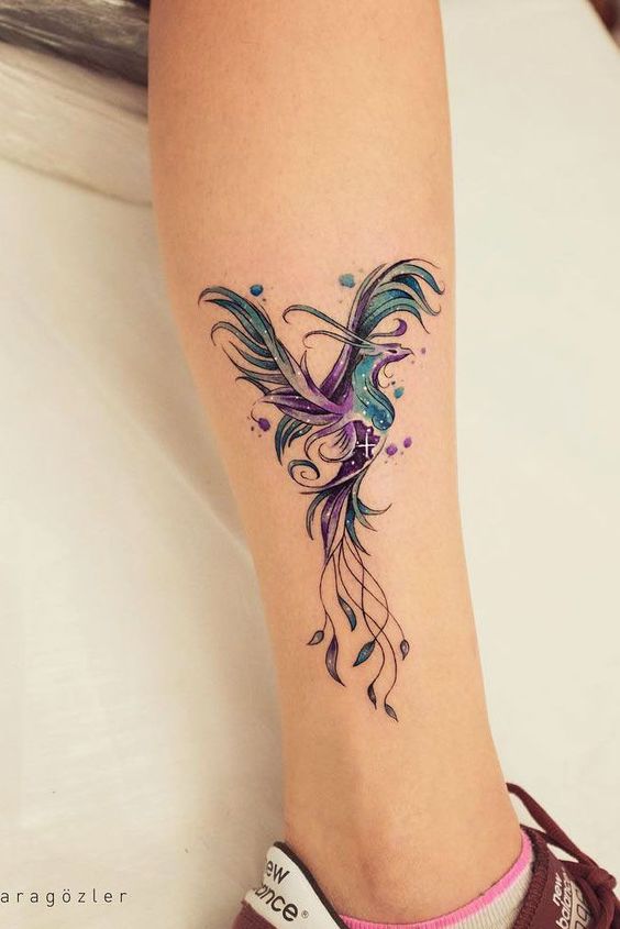 pretty phoenix tattoo on leg