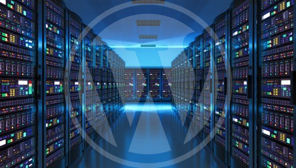 WordPress Hosting from GB Hosting - fast, specially optimised hosting for WordPress. Image shows a server room with the WordPress logo superimposed over it. The logo is quite transparent and white in colour.