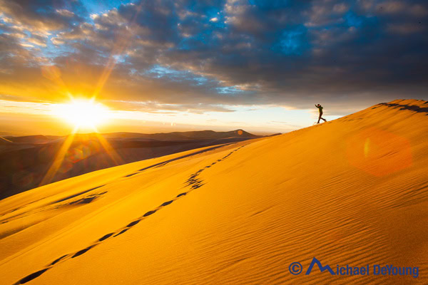 Running down sand dunes, Great Sand Dunes National Park, Colorado Running down sand dunes, Great Sand Dunes National Park, Colorado