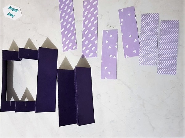 Pieces of the Concertina Card layed out with folds