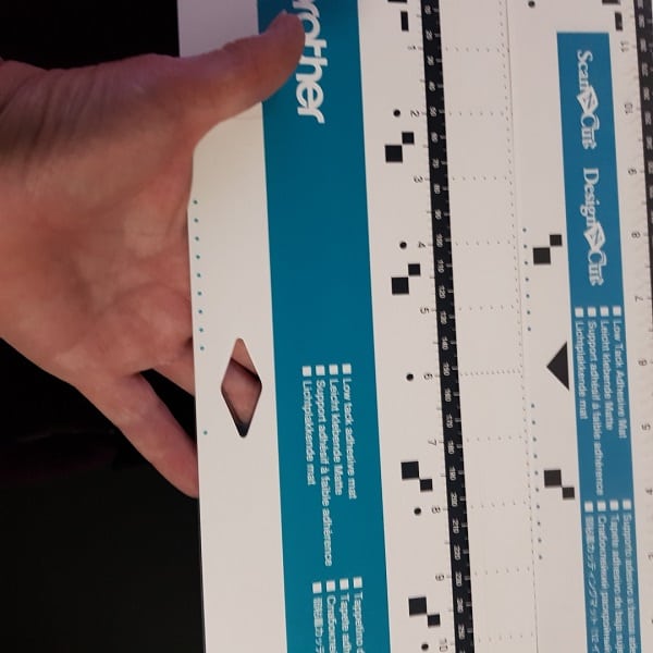 Small diamond cut out on the DX Scan N Cut helps identify that it is a DX mat