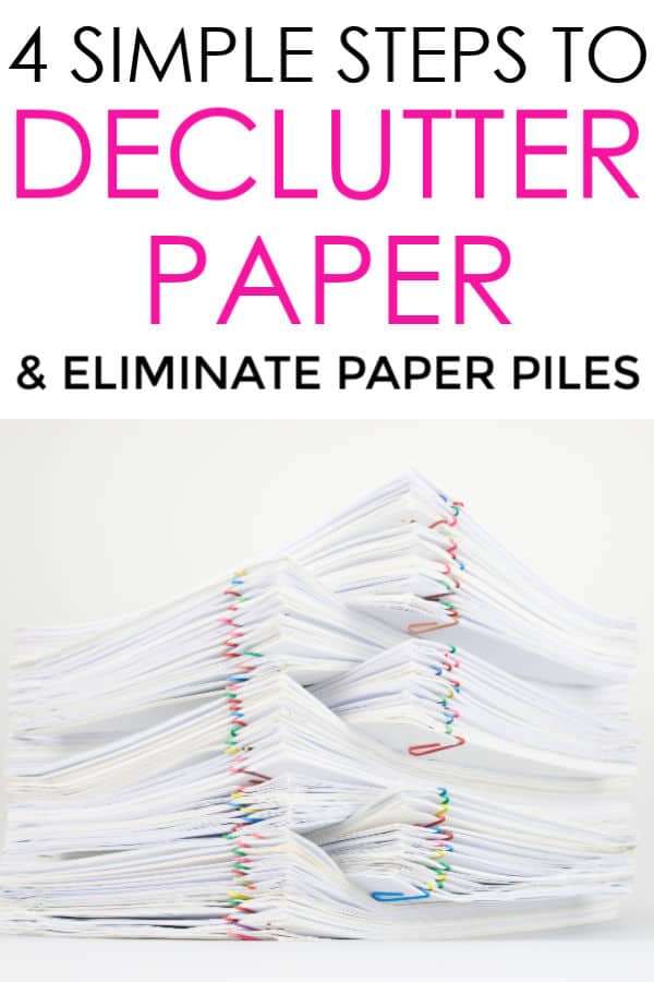 stack of white paper with colorful paperclips: declutter paper