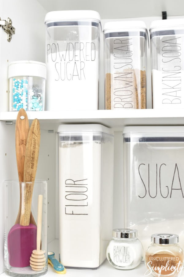 pantry organized with clear, labeled food storage containers