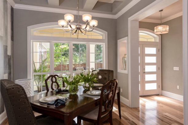 small and airy contemporary dining room with Sherwin-Williams ellie gray SW 7650 wall paint color