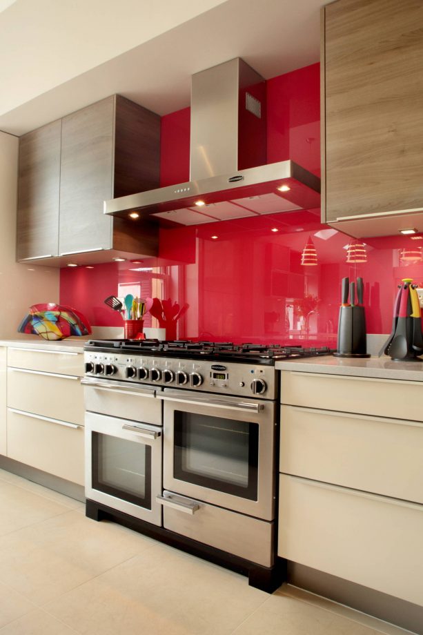 cream cabinets and red backsplash