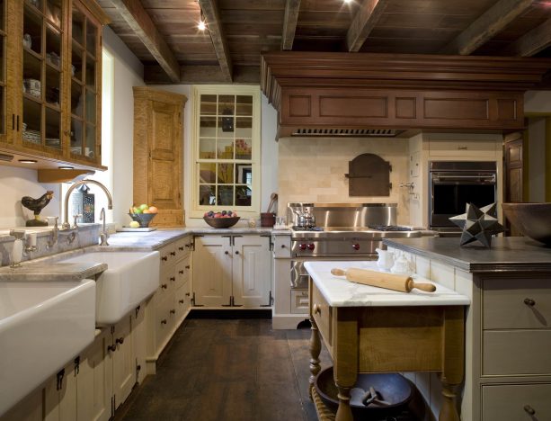 cream cabinets paired with repurposed hardwood floor and ceiling