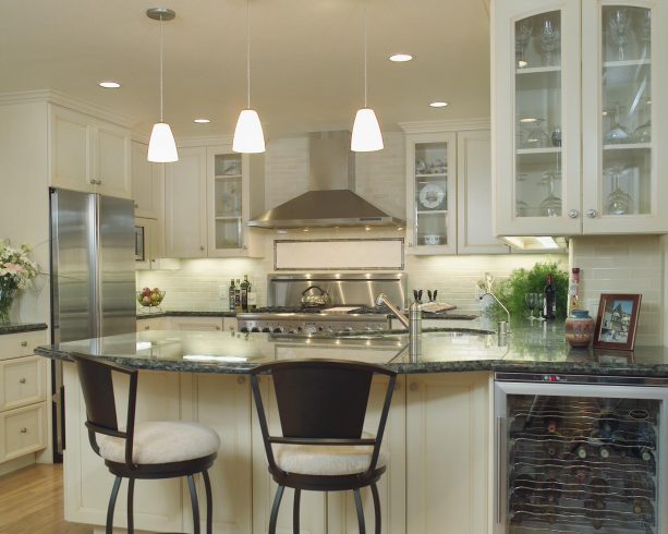cream kitchen cabinets paired with stainless steel appliances