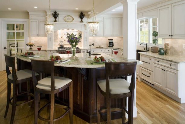 off-white cabinets, dark wood island, and some stools combination