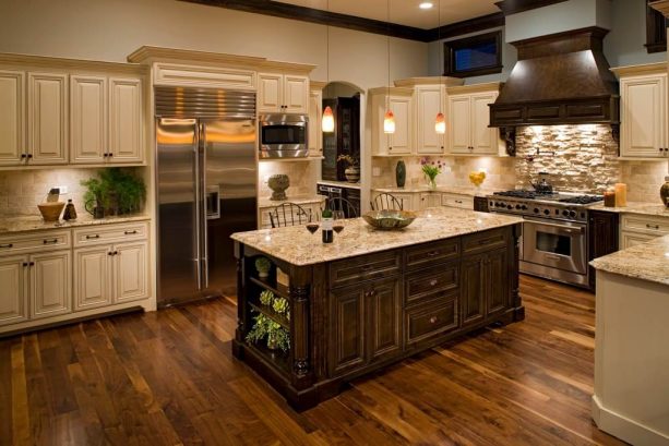off-white cabinets with gold granite countertops