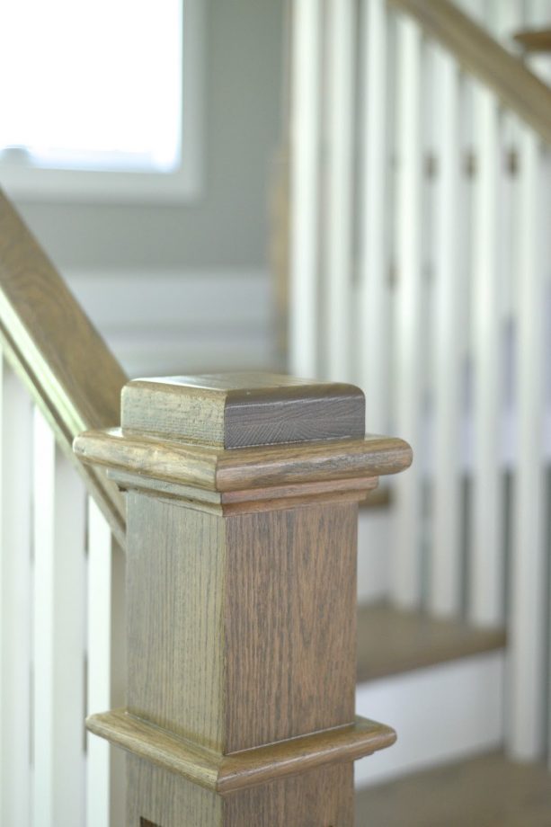 staircase newel and handrail with the mix of Minwax Weathered Oak and Classic Gray